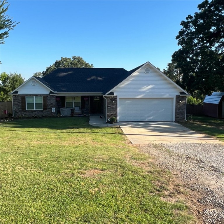 **More Pictures to Come Soon**Enjoy living in the country while still being close to the amenities of the city. Custom home built new in 2021 features 1479 square feet of living space. This home includes 3 bedrooms, 2 bathrooms, and a flex space. Tray ceilings in the living and master bedrooms and wood look tile throughout. The fenced backyard provides a secure places for the pets to roam as well.Master bathroom consists of a double sink vanity, walk-in tiled shower, and large soaker tub and a tankless propane water heater provides virtually unlimited hot water to fill it.Home sits on 1.25 acres just outside of town and within 10 minutes of fort smith, just north of Hackett, Arkansas. Kitchen appliances and storage building all convey with the home.