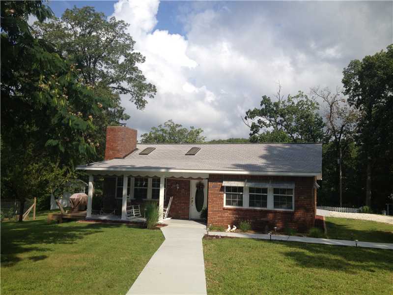 Property like this doesn't come along at this price often. Includes a well maintained brick home, large shop, garden shed w/ storm cellar, well house, pergolat w/ elec, gardens, large deck. Peaceful and serene only 1.5 mi to beaver lake with winter view.,New Roof in 2014!