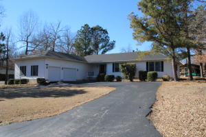 Elite subdiv with no HOA's. Home with 3 bed 2.5 bath is on .41 ac and has a winter view of Bull Shoals Lake. Covered and open deck for entertaining, paved circle drive and large 2 car garage provides plenty of parking. Master bedroom has walk-in closet and bathroom with wheel chair accessible shower. Vaulted ceilings in living room with wood fireplace and hardwood floors. If that's not enough there is over 1,000 ft of unfinished heated and cooled space in the basement.