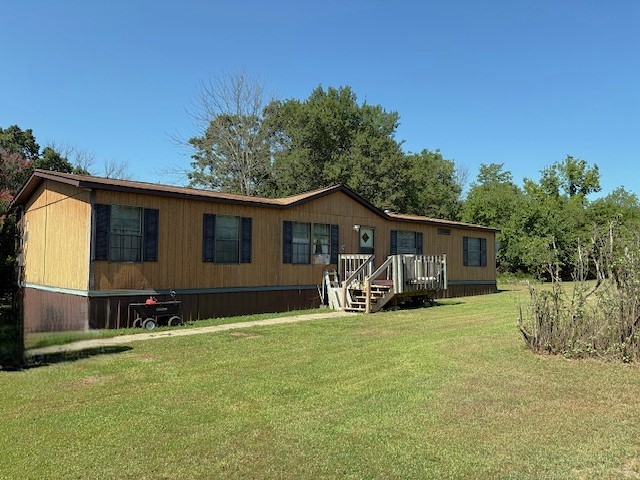 Escape to the tranquility of the Ozarks with this 3 bedroom 2 bath home set on 11 private acres m/l just minutes from Bull Shoals Lake. Whether you are looking for a relaxing lake house getaway or a comfortable year round residence, this property has everything you need. The land is a mix of open and wooded areas, ideal for gardening, recreation, or simply enjoying nature. A barn and outbuilding provide storage or hobby space and there's a great spot for a garden. Enjoy peace and privacy, while being close to world class fishing, boating and outdoor adventure. This is your opportunity to own an affordable slice of Ozark paradise. Actual Address is 4668 Lower Place Drive.
