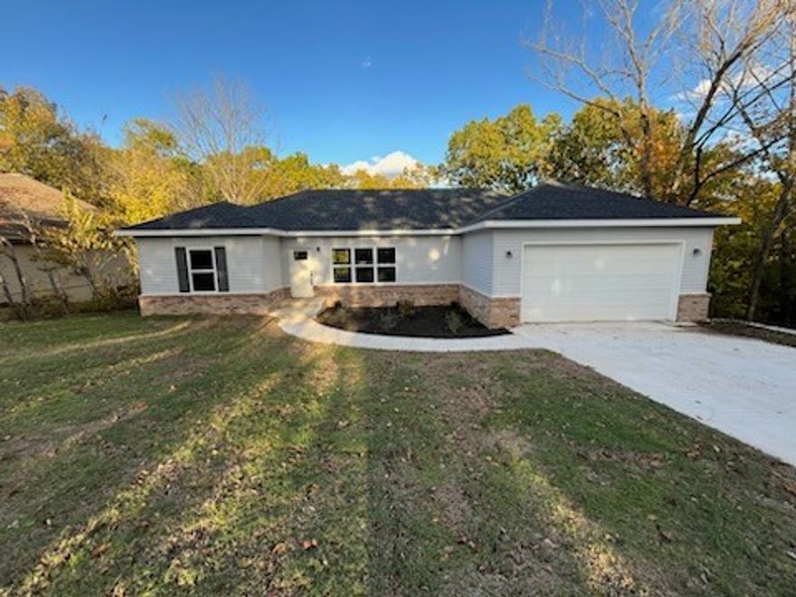 This stunning new construction home in Bella Vista offers 1,640 square feet with three bedrooms and two full bathrooms. The eat-in kitchen features elegant quartz countertops, while luxury vinyl plank flooring and energy-efficient LED lighting create a warm atmosphere throughout. The master suite includes a generous walk-in closet, and additional bedrooms provide flexible living space. Step outside to your private deck surrounded by mature trees for natural shade and privacy. Located in desirable Bella Vista with access to exceptional community amenities, this home combines modern finishes with the peace of mind of new construction.