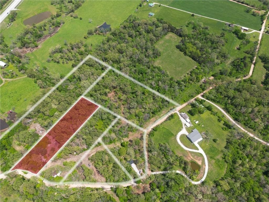 Hard-to-find 3-acre parcel in a great location—right off Boundary Line Road in Garfield. Whether you're looking to build, invest, or create a weekend getaway, this property offers flexibility and space. Mobile home or tiny home? Absolutely. Want a mini farm? This is it! Easy access, a mix of open and wooded areas, and plenty of potential to make it your own. Rural Water available at the street. Just the right size for privacy without the upkeep of a larger tract. Three other lots surrounding this one are available as well.