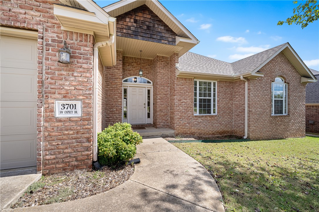 Welcome home to this full brick charmer in Eagle Creek subdivision in Bentonville. Spacious, 3 bed, 2 bath home with dedicated laundry room, eat-in kitchen and separate office. Living area features wood mantle and gas-log fireplace. Lots of space in the kitchen with movable, granite covered island, pantry and extra cabinets. Dining area has wood floors and tray ceiling. Laundry room has added storage and a utility sink. Primary suite has walk-in closet and access to the deck plus ensuite bath with dual vanities, shower and walk-in tub. Two other bedrooms bathed in natural light. Enjoy relaxing on the large, covered deck. Convenient location on a corner lot with large yard. New roof and HVAC.