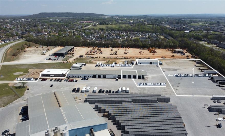 6,100 SF office bldg.
3,500 SF repair bay bldg – 3 bays (14’ x 12’).
5,000 SF detached warehouse bldg – 1 bay (12’ x 12’).
2.50 acres of storage yard.

This ±14,600 SF industrial property offers a versatile combination of office, warehouse, and outdoor storage space. The site includes a 6,100 SF office building, a 3,500 SF repair bay building with three 14’ x 12’ pull-through bays, and a 5,000 SF detached warehouse with one 12’ x 12’ bay, totaling 8,500 SF of warehouse space. The property also features 2.5 acres of storage yard.  Offered at $12.00 PSF NNN, the property is located approximately 4.5 miles from I-49, providing convenient regional access while accommodating operational flexibility across three separate buildings.