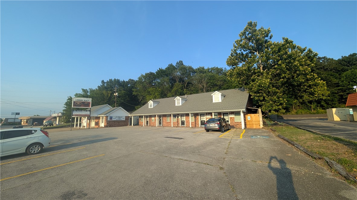 Professional $395 per month 1 room office space with access to one common maintained bathroom. This space has direct access from parking lot but is not road front office space. The owner pays: water, sewer, sanitation, and gas. This property has ownership interest by a family member of a Arkansas Real Estate Broker
