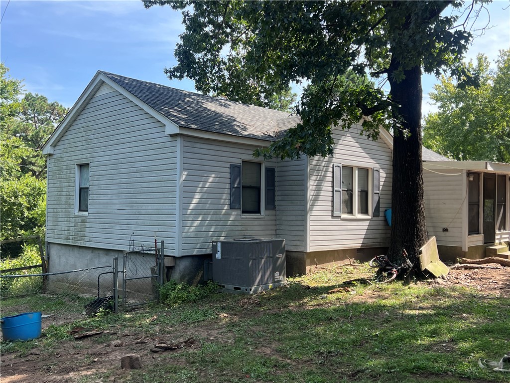 Come take a look at this cute hobby farm. Home is a 3-bedroom plus bonus room or 4th bedroom. Approx 10 minutes from the new WOKA park and bike trails; yet still close to Siloam amenities. New central heat/air unit in 2024. New roof in 2023. Pressure tank less than 5 years old. Several outbuildings, chicken coops, and trailer home stay.