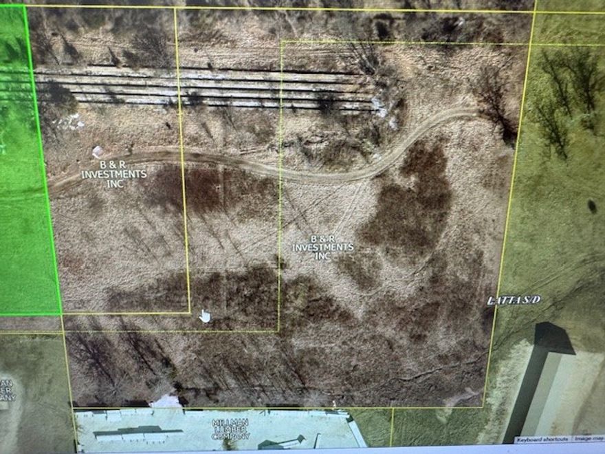 5.66 Acres! Great commercial or residential piece of land that has easement entrance off of Hwy 62. Owner might consider trade or owner finance. Agent owned.