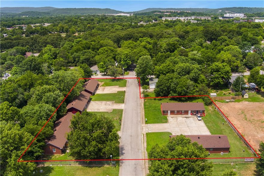 Here is your opportunity to own 5 buildings with 18 units, on 1.04 acres in South Fayetteville. Property consists of ten 400 sf studio units & eight 800 sf - 2 bedroom units and is located in an Opportunity Zone.  Located just one mile from downtown, a block from Walker Park, walking distance to the Razorback Greenway, walking distance to the Ramble- formerly known as the Cultural Arts Corridor, and a 6 minute drive to the University of Arkansas. Be a part of the growth happening in South Fayetteville and the Walker Park master plan area.