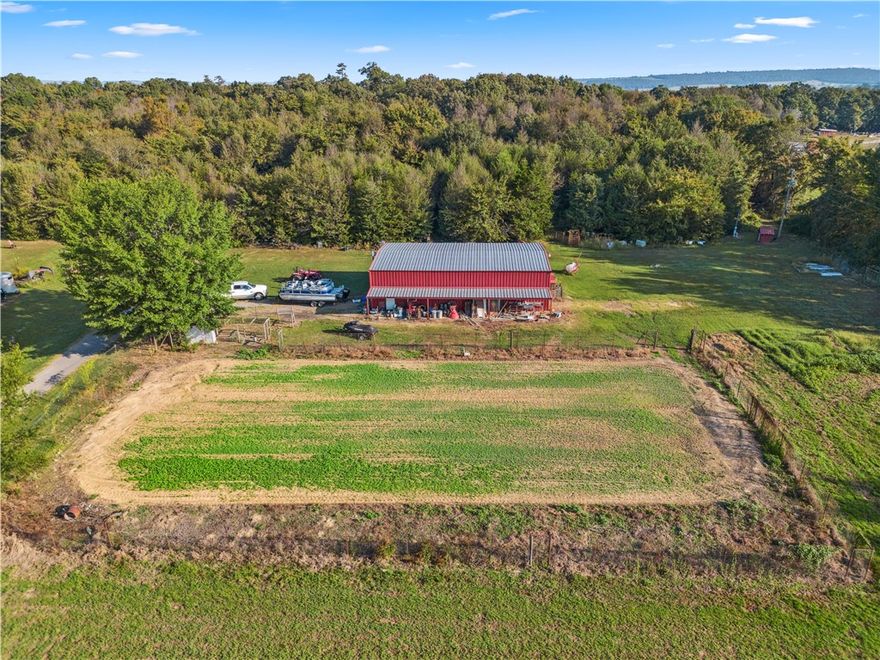 Welcome to your private retreat! This secluded 40-acre property offers the perfect blend of natural beauty and modern comfort. Featuring a stocked pond, expansive pasture land, and wooded areas, it's a paradise for nature lovers. The property borders a wildlife preserve, ensuring abundant wildlife sightings and added privacy. The stunning open concept home boasts over 5,000 sq. ft., with 2,890 sq. ft. of heated and cooled living space, providing plenty of room for relaxation and entertainment. 40X60 Insulated Shop!!  Enjoy serene views from the balcony, or step into the walk-out basement, offering endless possibilities for customization. With tons of storage and a spacious layout, this home is designed for comfort and convenience.