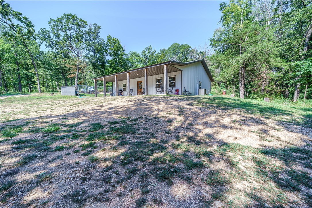 Tucked away among the trees just outside the city limits, this beautifully crafted custom home offers the perfect blend of comfort and privacy. Featuring 3 bedrooms and 2 bathrooms, the open floor plan seamlessly connects the spacious kitchen and living areaāideal for gatherings. The kitchen includes a pantry, a convenient breakfast bar for casual dining or conversation, and a designated space for family meals. A large laundry room with its own outside entrance makes it easy to come in from outdoor work or play without tracking through the house.