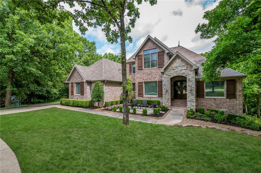 Absolutely Gorgeous golf front home in the prestigious gated community of Clear Creek and situated around the Renowned Blessings Golf course. Truly stunning! Entry features large windows, beautiful tongue and groove cathedral ceilings with skylights, engineered hand scraped wood floors, and formal dining. There is room for two chefs in this large kitchen with pantry and generous eating area.  Enjoy the outdoors on the screened porch. Master suite has a giant closet, massive walk-in shower and soaking tub. Every bedroom has an ensuite bath and upstairs has an additional washer and dryer. 
Walkout basement features large bonus room with bedroom, full bath and spacious kitchenette with wine closet!  This area is a great second living space,  mil quarters. All of this is tucked away on a quiet, professionally landscaped cul-de-sac  but still close to shopping, restaurants, medical facilites and schools and I-49.