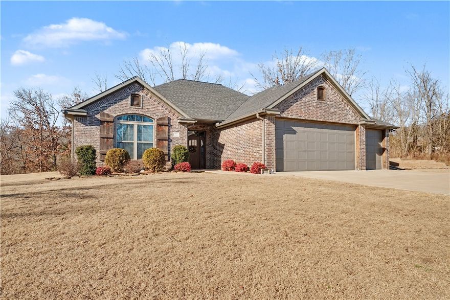 Better than new! This meticulously cared for 3 bedroom/2 bath home with an office is just waiting for you to call it your own. Built just a few years ago on two flat lots...it has everything a new home offers plus all of the window coverings and landscaping has been done for you. They've even added a storage shed that's an added bonus to your 3 car garage. Built with all brick...all four sides...low maintenance...long lasting comfort! With engineered hardwood flooring...you'll be stunned by the elegance and ease of living here. Let's talk kitchens...this one comes with a HUGE island that includes extra storage...and induction range and upgraded appliances. The Master is oversized...plus two guest rooms and an office! You will relax in the comfort of your private covered deck. Conveniently located across the street from the Scotsdale Golf Course and Pro Shop. Also convenient to the Walmart Superstore in Jane. And also close to mountain biking trails just a quarter mile down the road. This home truly has it all!