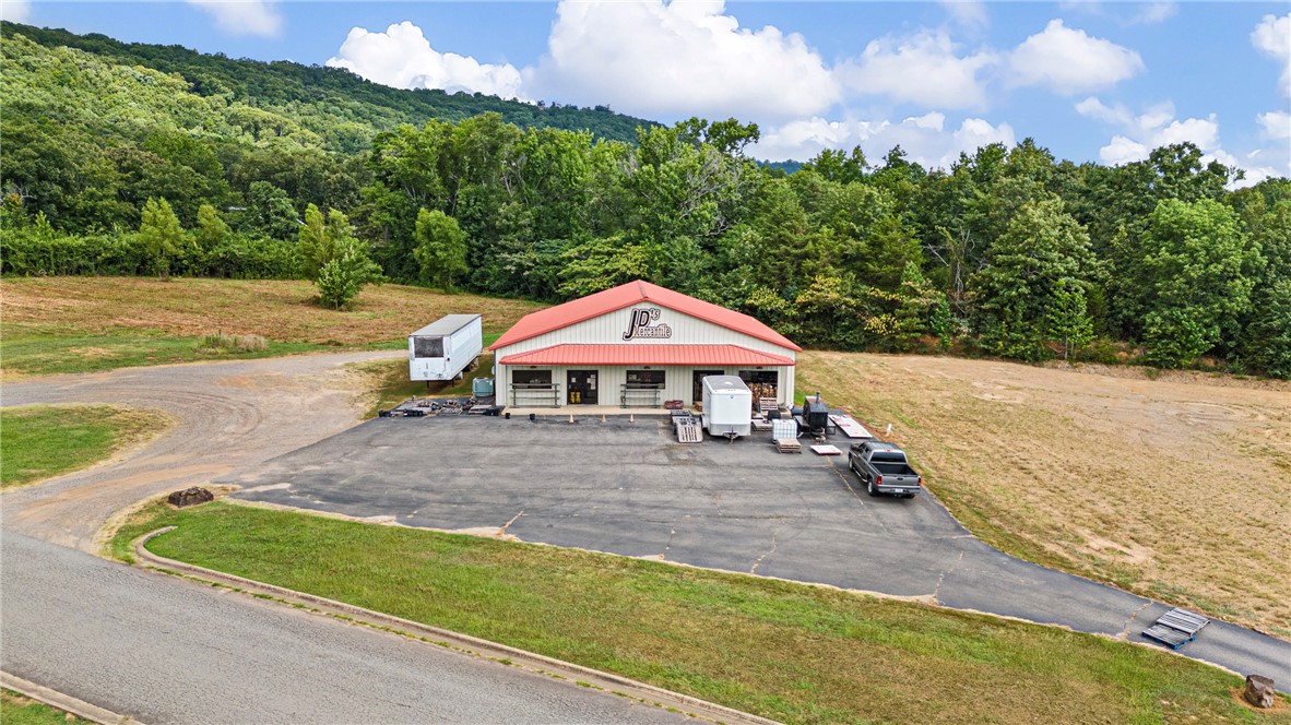 Outstanding commercial opportunity located just off I-40 Exit 94 in the heart of Atkins, Arkansas! This 4,200+ sq ft building has served the community as a hardware store for over 18 years and recently added a popular deli section. The structure offers spacious retail space, a fully operational deli area, two- 1/2 bathrooms, and ample storageāall situated on 1.87 acres of land with high visibility from the interstate. The property is ideally positioned behind Sonic Drive-In, near McDonald's, Dollar General, and Jordanās, benefiting from consistent area traffic and customer flow. I-40 boasts an Average Annual Daily Traffic (AADT) of approximately 8,800 vehicles, providing excellent exposure for any business use.
Zoned for commercial use, the land provides plenty of room for parking, expansion, or subdivision. Seller is open to dividing the property to suit buyer needs. Inventory and equipment are available to purchase for an additional price, making this a potential turnkey investment.