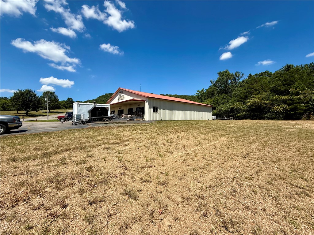Outstanding commercial opportunity located just off I-40 Exit 94 in the heart of Atkins, Arkansas! This 4,200+ sq ft building has served the community as a hardware store for over 18 years and recently added a popular deli section. The structure offers spacious retail space, a fully operational deli area, two- 1/2 bathrooms, and ample storage—all situated on 1.87 acres of land with high visibility from the interstate. The property is ideally positioned behind Sonic Drive-In, near McDonald's, Dollar General, and Jordan’s, benefiting from consistent area traffic and customer flow. I-40 boasts an Average Annual Daily Traffic (AADT) of approximately 8,800 vehicles, providing excellent exposure for any business use.
Zoned for commercial use, the land provides plenty of room for parking, expansion, or subdivision. Seller is open to dividing the property to suit buyer needs. Inventory and equipment are available to purchase for an additional price, making this a potential turnkey investment.