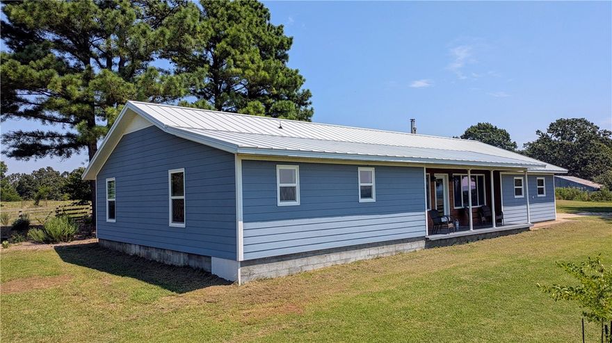 Country living and a 20 acre working farm with a spectacular view. This beautiful property has been taken care of and added too for over 10 years. New metal roof, new flooring, hardie plank siding, and vinyl low E double pane windows within the last 5 years. Large garden, orchard(apple, pear, peach, persimmon, fig, pawpaw), and native plant flower beds/landscaping. Includes several barns and a 32'x44' shop with a half bath. Also has a separate water, septic, and 50 amp electric for a camper/RV. This is a must see.