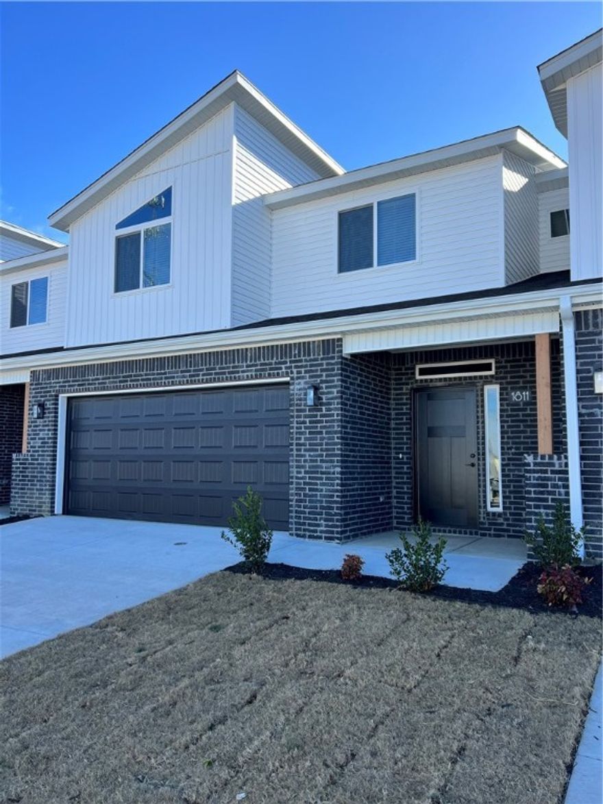 New construction Town-home offers 4 bedrooms, 3 full baths, and 1 half bath. This property features a private wood-fenced backyard, quartz countertops in the kitchen, a large pantry, and stainless-steel refrigerator. Washer and dryer are included! The primary suite is located on the main floor. Luxury vinyl flooring throughout the downstairs and upgraded carpet upstairs provides comfort and durability. Three additional bedrooms are upstairs with two full baths. A beautifully designed home with modern finishes and exceptional functionality. EV plug installed in garage. Owners must approve all pets and no smoking.