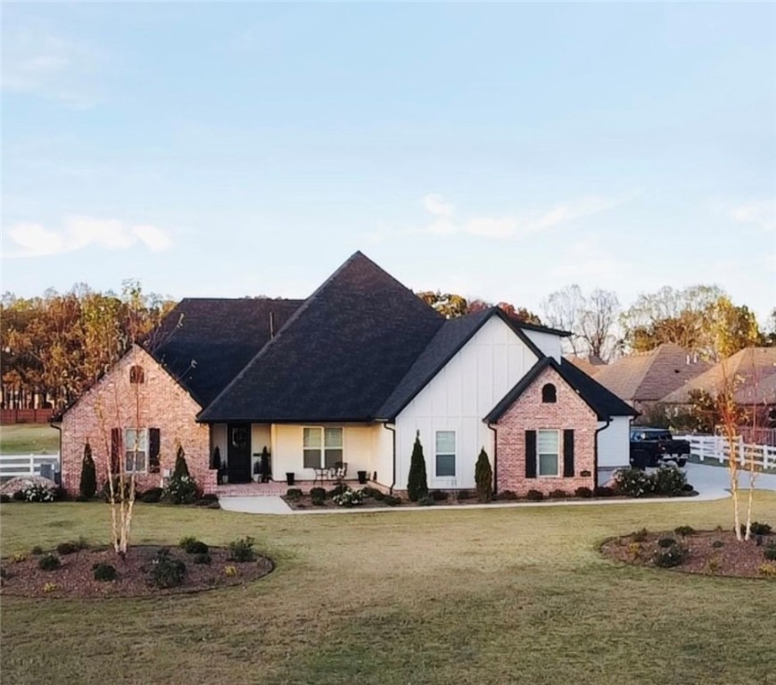 Agent owned Home. This one-of-a-kind builder's home has 4 bedrooms, 5 bathrooms, a home office, and beautiful screened in porch. It has a 3-car garage with a 20x30 metal shop and 20x24carport on the property. Lot size 2.01 acres beautifully fenced with 3 rail vinyl fencing on a private driveway.
Property Features
Luxurious Interiors:
Beautiful wood beams
Elegant hardwood floors throughout
High ceilings throughout
Custom built-ins in closet
Spacious primary suite with custom built-ins and a luxurious bath
Multiple living spaces, including a cozy screened-in porch with a fireplace
Well-equipped home office
Dedicated gym room
Outdoor Oasis:
3 car garage
Expansive 3 car carport
20x30 metal shop for hobbyists and DIY enthusiasts
Large backyard with plenty of room for outdoor activities
Beautiful white fencing on the outside
room for a pool Modern Conveniences:
Central vacuum system
Security system
Pre-wired sound system
Two laundry rooms
Instant hot water