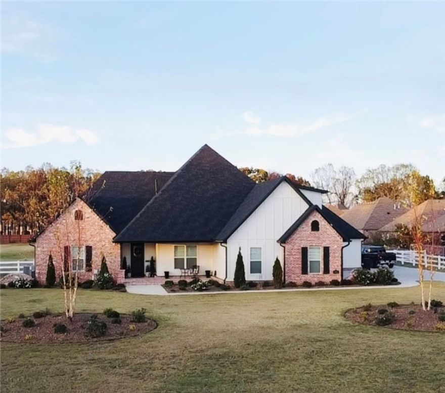 Agent owned Home. This one-of-a-kind builder's home has 4 bedrooms, 5 bathrooms, a home office, and beautiful screened in porch. It has a 3-car garage with a 20x30  metal shop and  20x24carport on the property. Lot  size 2.01 acres beautifully fenced with 3 rail vinyl fencing on a private driveway.

Property Features

Luxurious Interiors:
Beautiful wood beams
Elegant hardwood floors throughout
High ceilings throughout
Custom built-ins in closet
Spacious primary suite with custom built-ins and a luxurious bath
Multiple living spaces, including a cozy screened-in porch with a fireplace
Well-equipped home office
Dedicated gym room

Outdoor Oasis:
3 car garage 
Expansive 3 car carport
20x30 metal shop for hobbyists and DIY enthusiasts
Large backyard with plenty of room for outdoor activities
Beautiful white fencing on the outside
room for a pool                                Modern Conveniences:
Central vacuum system
Security system
Pre-wired sound system
Two laundry rooms
Instant hot water