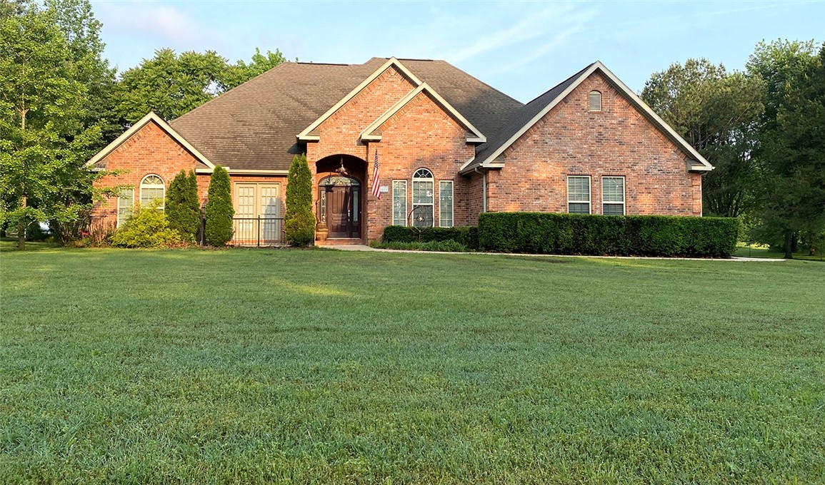 You do not want to miss this one. Peaceful surroundings on almost 5 acres, including a pond, and a view of the white river. Bring your animals, green thumb and love of country living to this lovely property. Only 10 miles from downtown Fayetteville. This well maintained home is sure to bring your family joy!