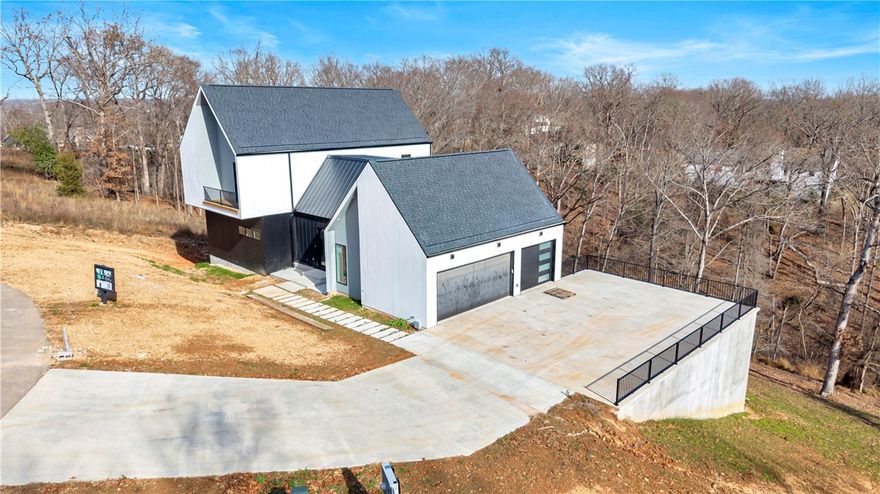 This modern three story retreat invites you to live in a space that feels inspiring, elevated, and unforgettable. The moment you enter, the custom floating staircase becomes a true architectural centerpiece, guiding you into open, light filled living areas designed for gathering, celebrating, and slowing down. A stunning wine room sets the tone for intimate evenings, while expansive windows frame calming views of the trees, creating a sense of privacy and peace. Step onto the large deck and you’ll feel the heart of this home—a place to host dinners under the stars, sip morning coffee in the quiet, and take in the beauty of nature all around you. Builder and partners are also offering up to $10,000 in buyer concessions toward closing costs or upgrades when using the preferred lender. Built by Key Concepts. Learn more at www.yourkeyconcepts.com. A leased boat slip at Prairie Creek Marina and a Cobalt boat may convey with an acceptable offer.