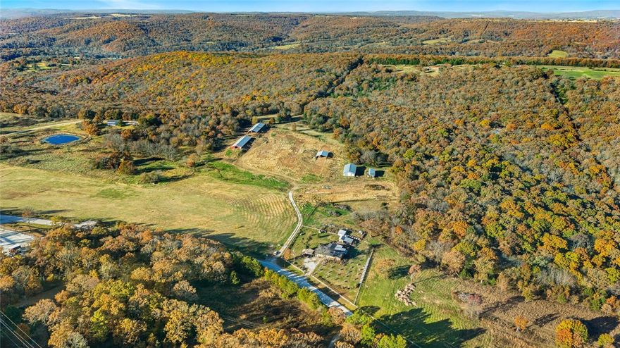 27MOL AC. In the Boston mountains on pave State Highway 265 about 20 minutes south of Fayetteville and close to Devils den State Park and recreation area. 10 to 15 minute drive to Prairie Grove, Greenland and West Fork. Property has a mix of pasture and woods and several building sites. Property includes a 40 x 90 shed with concrete floor and two overhead doors. New ozark electric power service and Washington water service in 2023. Endless possibilities on this property (RV park), campground, farmstead, prepped complex or even a business location. Chicken house that shows up on Google maps are no longer there. Property has elevation and gentle terrain. A beautiful slice of NWA.