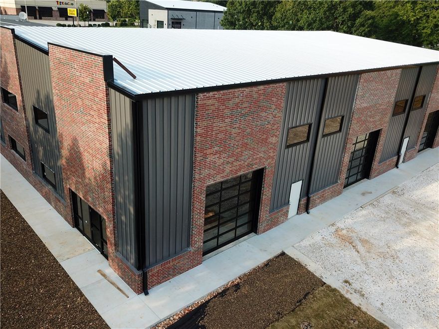 Brand new flex space in Johnson. Excellent location in Johnson right off of Main St. Close to Fayetteville 
and Springdale. Easy access to I-49 and 71B. Designed to be used as office & warehouse space. 9300 sq ft with three 12x12 drive-in doors. Wall height is 24' at the lowest point. Fully air conditioned. Parking lot is now paved with 16 spaces.