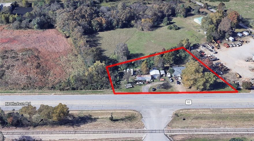 Planes, Trains and Automobiles...Location Location Location...with 328 feet of highway frontage! This 1975 1-Story, 3-Bedroom, 1.75-Bath, full brick home, attached 2-car sized storage area off utility room (with concrete block and stairs that lead down to a storage cellar) could easily be converted back into a 2-car garage, 24x24 metal shop building added in 2014 with large garage door and a side entry door (for garage or storage or workshop). Situated near airport / across the highway from train tracks / and on a busy road, near other businesses. Well house present, but not in working condition at this time. This is a good starter home or rental investment property zoned residential (but it could go through rezoning - to change to commercial or industrial), it needs a lot of work and TLC to help make this home or property yours.  See 3D-Matterport Tour for the Floor Plan layout of the house only. Lots of debris inside and outside of this property in which everything is all sold as-is.