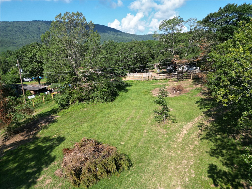 With stunning mountain views and a cleared, ready-to-build 2-acre spread, this Haney Hollow Road property checks every box. It already has a septic tank in place, an electric meter on site, a water meter with active service, and two passed PERC testsāso you can skip the setup and get straight to planning. The land is mostly cleared but still has many beautiful mature trees left for shade and privacy, and it's nearly fully enclosed with a large wooden fence. Best of all? There are no restrictions, giving you total freedom to build, move in a mobile, or create your dream setup in a peaceful, scenic setting.