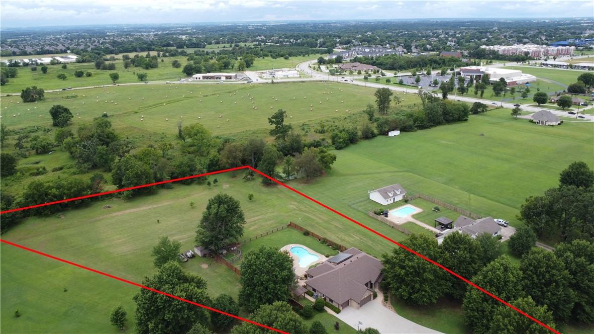 Rare opportunity to own a piece of paradise in the highly sought after Pinnacle area of SW Rogers. This 3.61-acre property boasts a 3200 sq ft home on one level and an 800 sq ft detached guest house. Back yard is private and features an inground pool, pergola, quality built covered back patio, koi pond and a custom chicken coop all nestled on a dead end cul de sac street with a park like setting. Whether dipping in the pool or feeding the fish in the koi pond or sipping your favorite drink while watching the sun set, this private paradise will be your place of Serenity.