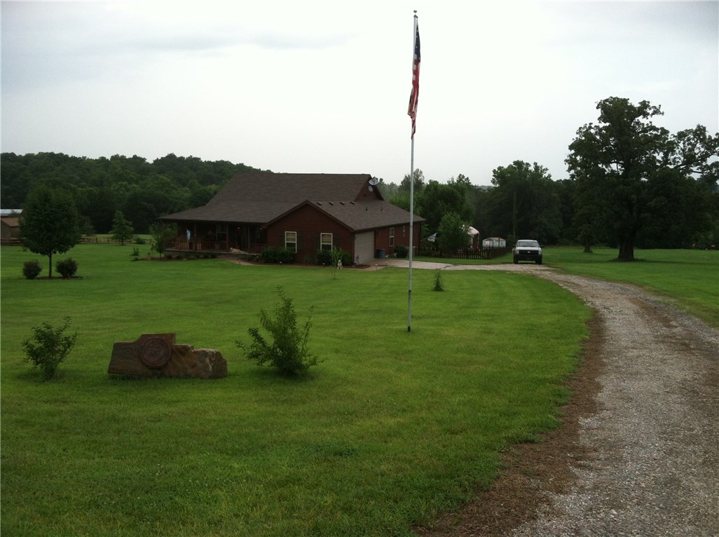 Very nice, clean, well built country home on 3 acres. Rural water, well, spring, paved road. Extra nice 3 bedroom, 2 bath, 2 car garage, with bonus room. This house has lots of extras. 45'x80' vegetable garden, 16x20 chicken coop, 12x16 Gazebo, 48.6x14 back deck & 38.5x7.3 Porch. See attached list for details of the extras & Survey.