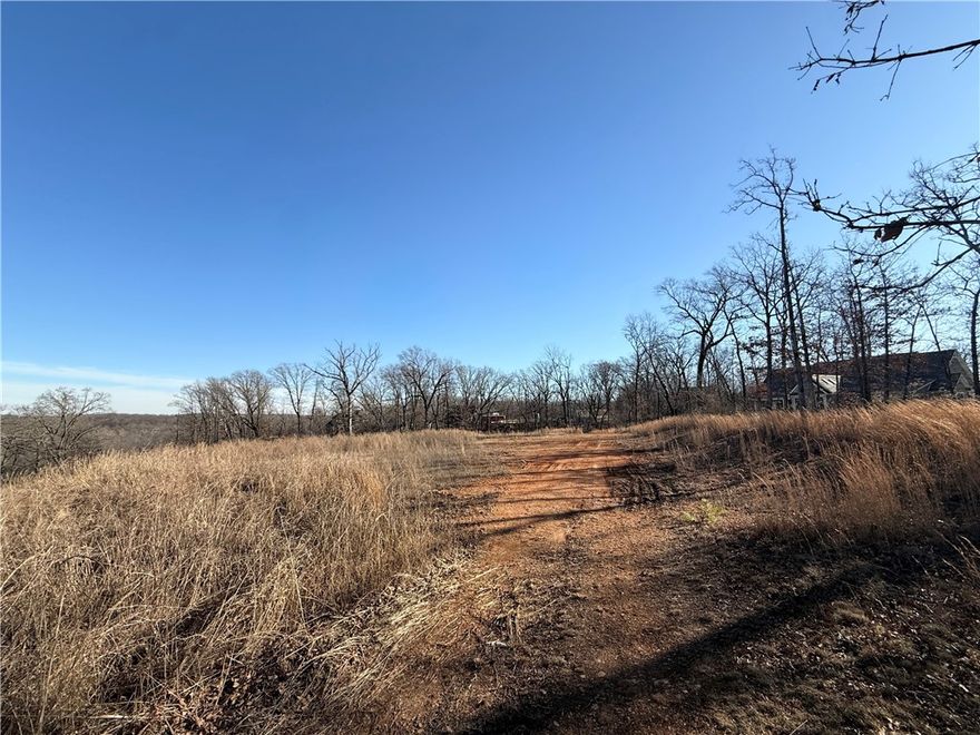Build-ready lot featuring flat, usable acreage at the top of the property. A septic system is already in place, saving time and cost for future development. Lightly wooded, offering both privacy and flexibility for building. City utilities, including water, gas, and electricity, are available at the street. Excellent opportunity for a custom home site in a desirable area.