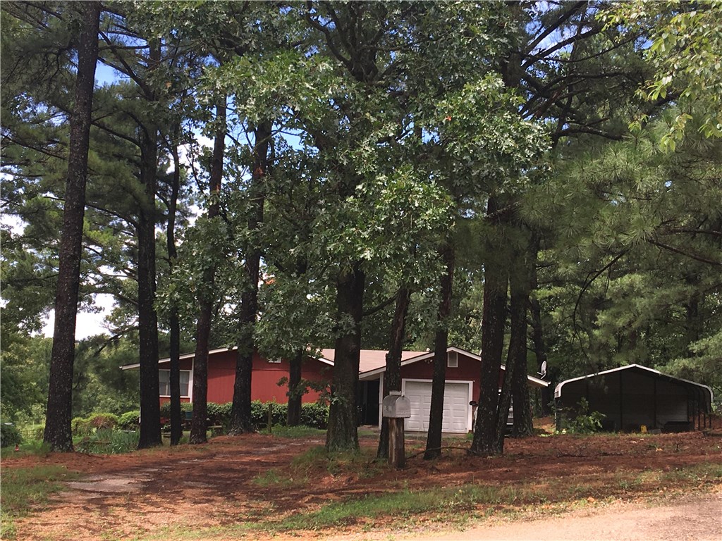 Welcome home!! to this Beautiful Peaceful Place on 4.70 acres. The street address says it all set on your deck and watch the Hummingbirds and deer. Park setting in huge pine trees. Hardwood flooring through the home, exposed wood beam ceiling's in the living room. Wood burning insert keeps you toasty in the winter. Sip coffee in your sunroom overlooking the valley. Crossed fenced for livestock. Garden spot this home has it all. Wow your look is over better hurry. Workshop in garage,new Heat-pump 2016