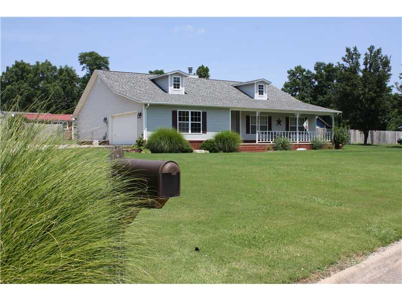 Country Living at it's Best! Custom Built 3 Bedroom, 2 Bath Split Plan. Newer Windows & Roof! Eat In Kitchen W/5 Burner Gas Range & Island. Plenty of Cabinetry W/Pullouts. Refrigerator conveys as a Gift! Lots of outside,enjoyment like coffee on the front porch, grilling on the back patio or growing your own veggies in the garden spot! Privacy fenced yard with nice storage bldg. and areas to park the lawn equipment. Seller W/Pay $2,000.00 of Buyer's Closing Cost w/acceptable offer.