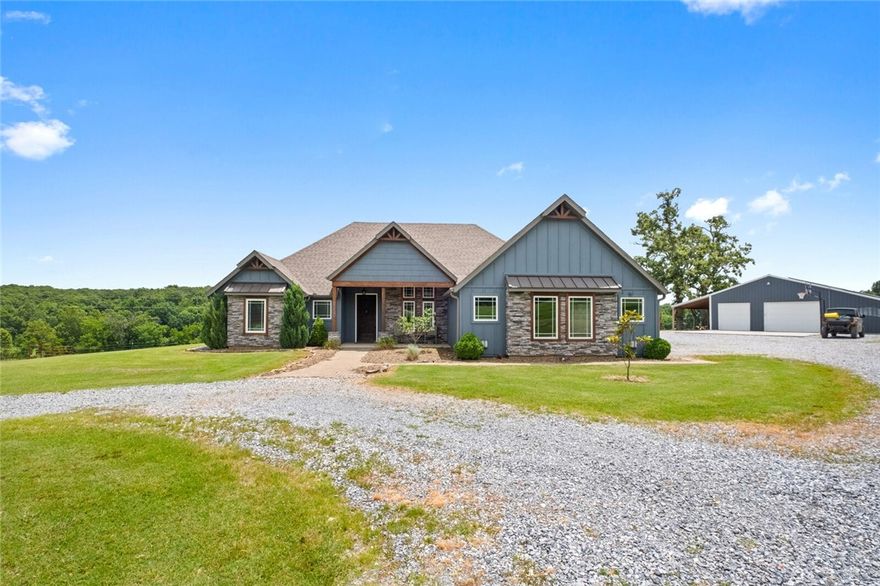 Discover your own private retreat on 30 acres of scenic countryside, complete w/ a peaceful live creek & stunning valley views. This beautiful 4-bed, 3-bath home offers 2,671 sq. ft. of thoughtfully designed living space, including 2 spacious living rooms. The gourmet kitchen features quartz countertops, ample cabinetry, & a 2-sided see-through fireplace that connects to the covered screened in back porch. Enjoy outdoor living year-round with a heated back porch overlooking a sparkling heated pool, complete w/ a diving board & tanning ledge - ideal for both relaxing & entertaining. The property also includes a 30' x 50' shop w/ a 10' lean-to, a heated & cooled room perfect for a gym or man cave, & a separate 1-bedroom, 1-bathroom apartment—ideal for guests, extended family, or rental income. Additional features include solar panels for energy efficiency and wide-open outdoor space with endless potential. This rare estate blends comfort, versatility, and natural beauty. Don’t miss your opportunity to call it home.