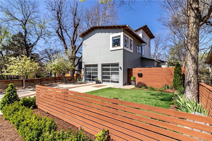 Situated on the North edge of the Washington Willow Historic District in central Fayetteville, this contemporary styled home welcomes you with abundant natural light at every turn. All common space is on the 1st level, including an open kitchen, that opens to both the dining rm, reading nook, living rm, half bath, the expansive back patio, cooking & fire pit space. A large picture window in the kitchen overlooks the outdoor space w/ the sliding glass doors in the living room opening to the same, further bringing the outdoor space in.  An oversized quartz island is the kitchen centerpiece & bamboo hardwood floors can be found throughout the downstairs, on the stairs, and in the master bedroom. The master suite has a tall vaulted ceiling w/ large windows that reveal the feel of being in the tree tops. A pocket door leads to the master bath, which is appointed with double vanities, a standalone tub & walk-in shower. Two additional upstairs bedrooms share an additional bath.