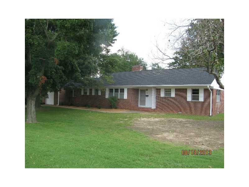 Well built brick 3 bd rm 2 bath on just under an acre of land. Residential but possibly could be zoned light commercial. Large living room/dining room combo, eat in kitchen with hobby room or office connecting. Great closets and storage, double fireplac