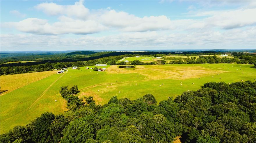 Welcome to a rare and versatile opportunity on 132± acres of prime Ozark acreage, just 6 miles from Lincoln and only 25 miles to Fayetteville - the perfect blend of seclusion, functionality, and accessibility. This generational cattle and hay farm has been in the same family for over 50 years, showcasing a legacy of hard work, stewardship, and pride passed down through the decades. The land features well-maintained pastures, fully fenced and cross-fenced for livestock.