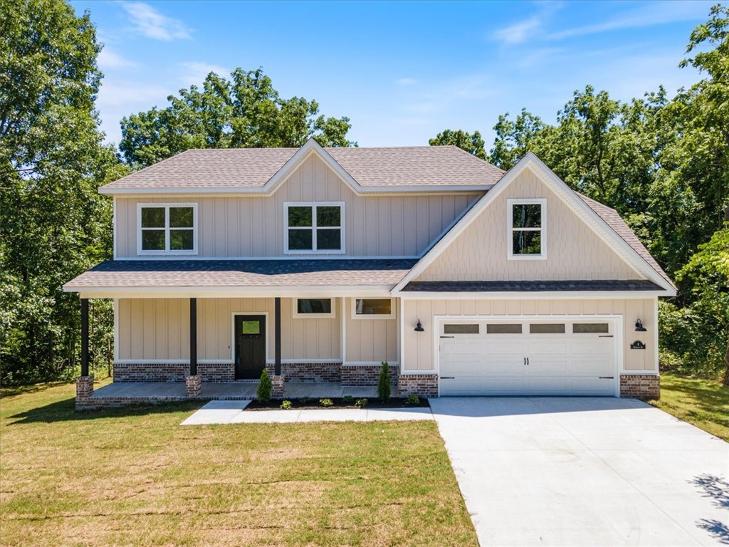 New construction on a level .28-acre lot with wooded views! Just down the street from Highlands Golf Course and provides quick acess to I-49 and Loch Lomond. Discover an additional 331 sq ft of floored attic space. 3 bedrooms / 2.5 baths (primary bedroom is on main level) Features include 3 cm counters, 10-foot ceilings, built-ins, custom cabinets, large kitchen, gas range, pantry, and two covered porches. High-end finishes finishes throughout! $3,000 IN BUYER CLOSING COSTS PAID FROM BUILDER'S PREFERRED LENDER