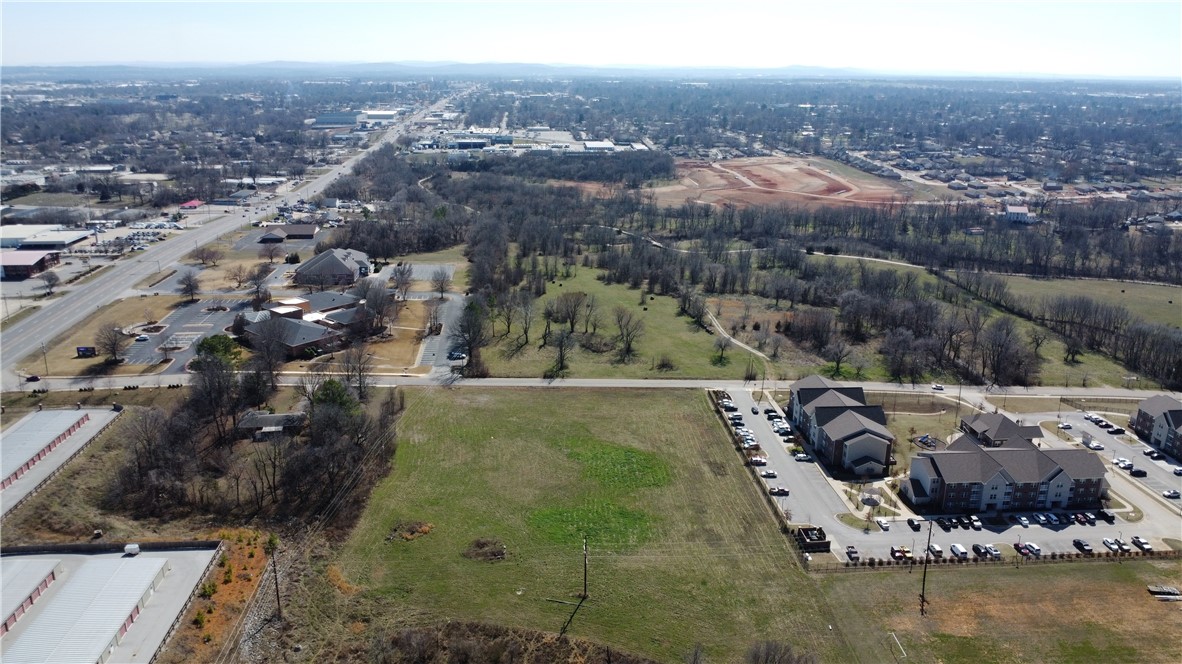 This 5.7+/- acre development site in Springdale, AR offers investors and developers a chance to own a high-density site in one of the fastest growing areas in Northwest Arkansas. The parcel is level and clear, making this site prime for development. All utilities are available at the street in front of the property. Being located one block off of 71B/Thompson St in the middle of Northwest Arkansas also makes the site easy to commute to and from Fayetteville and/or Bentonville, allowing tenants to reach all of NWA in under 30 minutes. The property is 3.9 miles/8 minutes from JB Hunt HQ, 4.4 miles/10 minutes from Tyson HQ, and 20 minutes to both Walmart Home Office and University of Arkansas. While the site is currently zoned RMF-24, the property would also be well suited for industrial development considering its proximity to 71B and other nearby industrial projects. Priced at under $3.50/sf, this property offers an attractive cost basis ensuring a solid foundation for your next project.