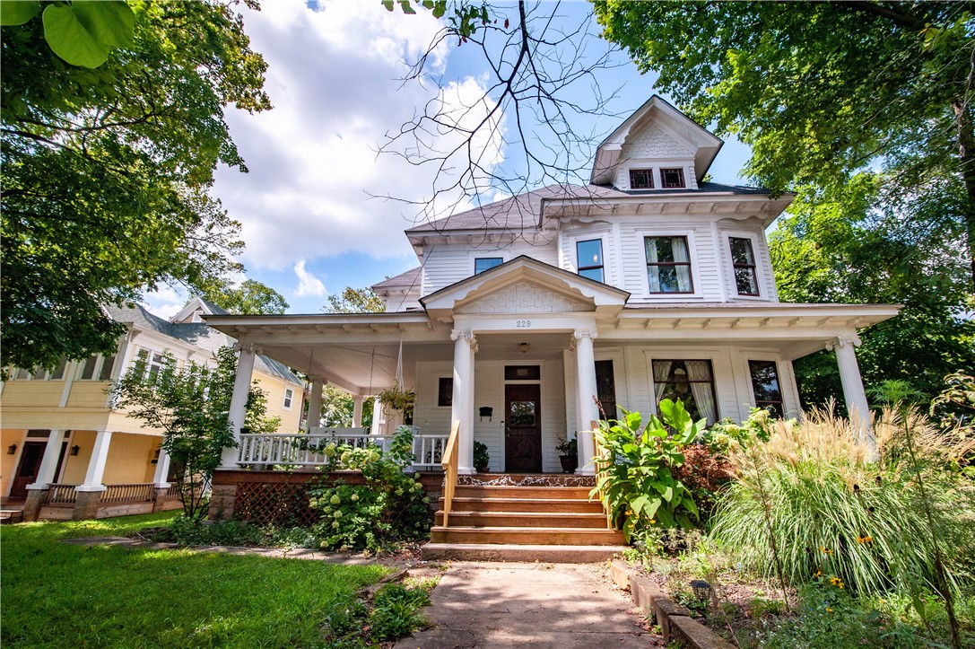 Welcome to The Heartbreak House — a 2,904 SF gem on one of Fayetteville’s most beloved streets, Block Avenue. Zoned Main Street Center, this versatile 4 bed, 2 bath property has lived many lives: cherished home, ballet studio, intimate concert venue, analog recording studio, and creative commercial office space. Steps from the city’s favorite restaurants, bars, the U of A, performing arts centers, and Razorback Greenway, its location is unmatched. The kitchen was fully renovated down to the studs in 2013, blending modern function with timeless charm. Original wood floors and trim have been lovingly preserved, complemented by updated electrical, plumbing, and new windows in the kitchen and upstairs. Original windows remain in the main studio, preserving its historic soul. A rare, character-filled space in the heart of downtown, ready for its next chapter. Also listed as Commercial (ML# 1316833).