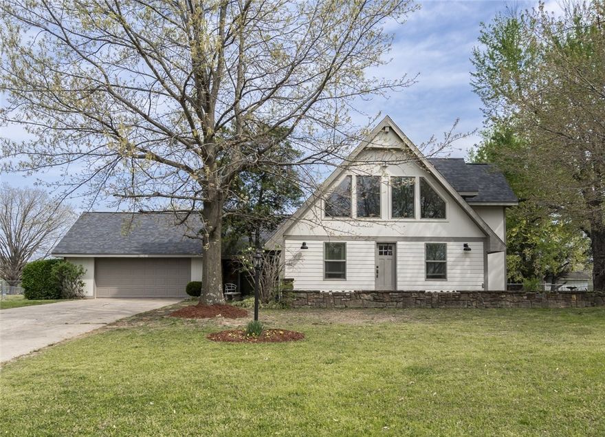 Stylish home with 4 bedrooms 2.5 bath on almost 1 acre in established neighborhood. Located less than 30 minutes to I49. This home features spacious living areas, contemporary fixtures, and a large, fenced back yard, making it an ideal home for you. Every corner of this home is designed to offer both comfort and style, inviting you to create memories that last a lifetime. Downstairs complete with wood floors, rock fireplace, exposed wood beams, spacious primary bedroom and guest room. Upstairs you’ll have 2 guest rooms, one with built-in bunks, a full bathroom and a loft overlooking the downstairs.
 Newer roof and new windows installed recently offer up beauty and energy savings. 
Come and see for yourself why this property defines home sweet home.