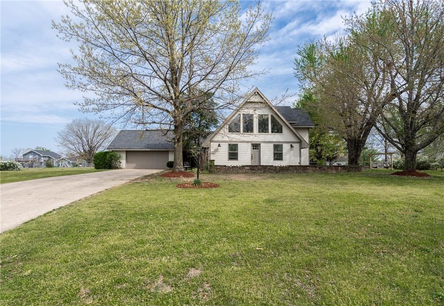 Stylish home with 4 bedrooms 2.5 bath on almost 1 acre in established neighborhood. Located less than 30 minutes to I49. This home features spacious living areas, contemporary fixtures, and a large, fenced back yard, making it an ideal home for you. Every corner of this home is designed to offer both comfort and style, inviting you to create memories that last a lifetime. Downstairs complete with wood floors, rock fireplace, exposed wood beams, spacious primary bedroom and guest room. Upstairs you’ll have 2 guest rooms, one with built-in bunks, a full bathroom and a loft overlooking the downstairs.
 Newer roof and new windows installed recently offer up beauty and energy savings. 
Come and see for yourself why this property defines home sweet home.