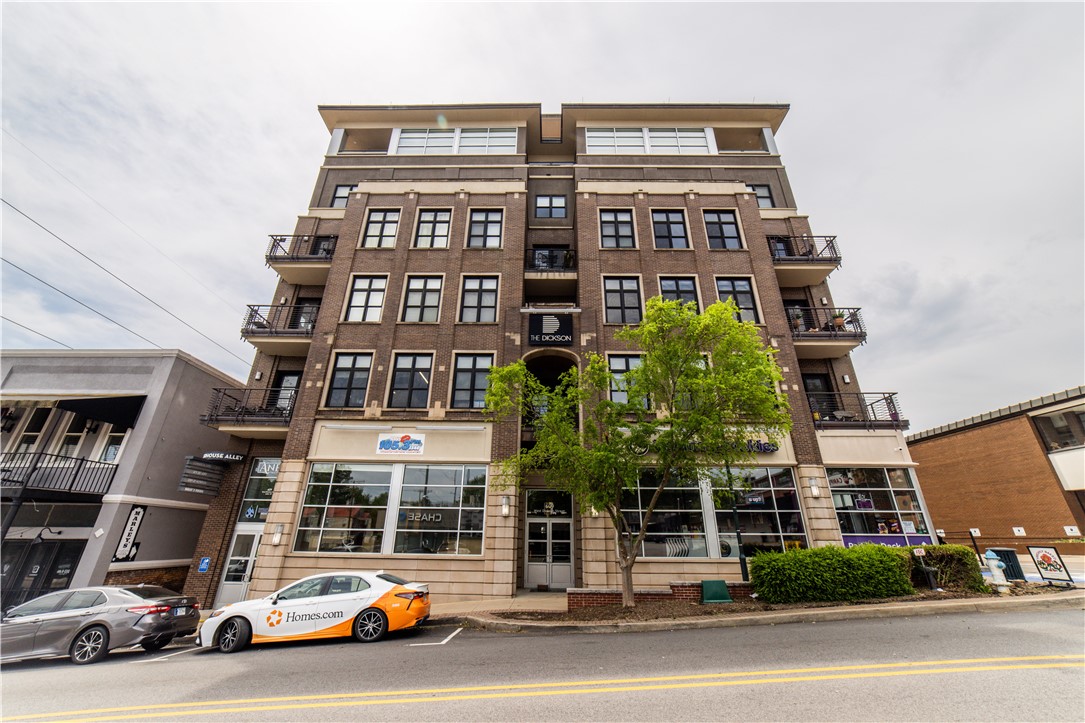 Dont miss this rare opportunity to own a fully furnished one bedroom condo at The Dickson. Enjoy an open floorplan with modern furnishings that opens up to a balcony with a view of Old Main. The Dickson is a secured high rise building accessed only by owner key fob with its own parking garage attached for your convenience. Walk out the front of the building right into the middle of the Entertainment District with restaurants, shops, and night clubs all around. Just up the street is the UARK campus and next door is the new park/trail system. This would make an amazing spot for you on Razorback Gamedays or an incredible investment property. This is THE place to be!
