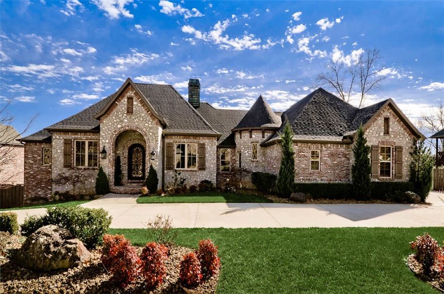 Rustic Elegance in this Stunning Avignon home!  Mixing elegant details with rustic wood features creates warmth that flows throughout this family home.  Home boasts 4 Living areas, equipped media room, Infinity edge gunite pool, 4 car side load garage, HUGE storage spaces, 2 bedrooms on main level and 3 on lower level, Extensive trim package through out, high end appliances, convenient location to Wal-Mart H.O., trail system, shopping, schools, I-49, and so much more!