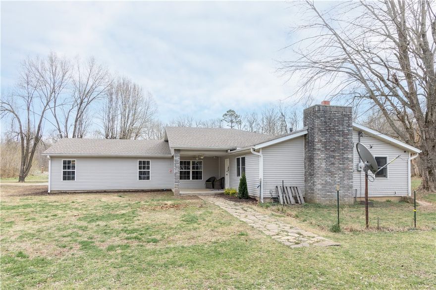Country living at its finest. Come see this house located on 6.33+/- acres of beautiful rural living. Close to all amenities that Rogers has to offer, this is a property you don’t want to miss. Located on your own slice of Little Sugar Creek as well as an above ground pool this home is perfect for entertaining. New water heaters in 2022 & 2023. New roof on 2023. New pool liner and updated filter in 2023. Call today to schedule your showing!