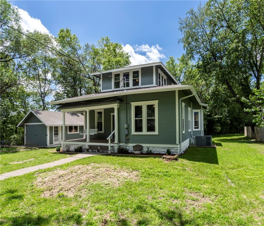 This charming historic home in downtown Siloam Springs is situated at the end of a quiet street with lovely views of Sager Creek. It features 3 bedrooms, 2.5 bathrooms, and a remodeled kitchen with custom cabinets, granite countertops, and stainless-steel appliances. The home has refinished original hardwood floors, new windows that bring in natural light, a large dining room perfect for gatherings, and the original front door complete with a vintage-style doorbell for added character. This property offers the ideal blend of history and modern updates in a peaceful setting.