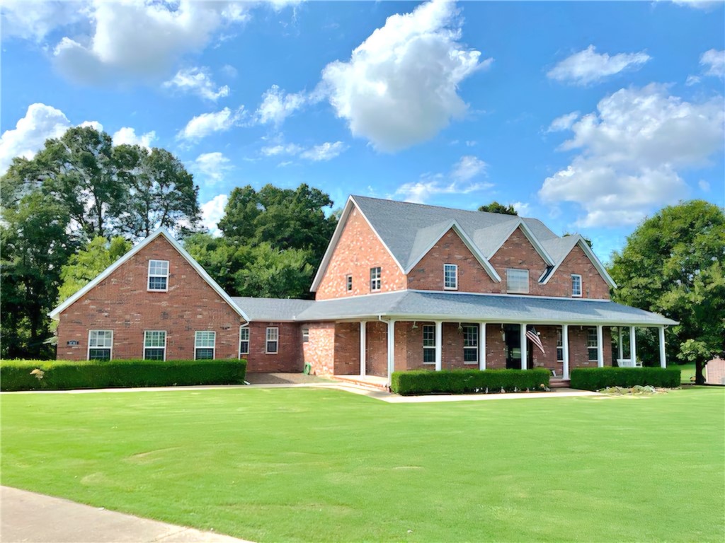 Discover this stunning 4 bedroom, 3.5 bath Home just minutes from Fayetteville and the University of Arkansas. Sitting on 1.2 acres this property offers a blend of privacy and country living. Formal entry with grand staircase, complemented by wood floors throughout. Formal office features custom shelving perfect for working at home . In the living area Relax around the gas fireplace and enjoy the natural light from large windows. The kitchen features granite countertops, island workspace, and large walk-in pantry. Enjoy your meals in the adjacent, formal dining room. Upstairs, you will find an on suite with private bath, and an additional two bedrooms with shared jack-and-jill bathroom, recently updated with fresh carpet and tile. Three car garage with bonus room above for overnight guests, playroom, or theater. Outside, you will find plenty of shade trees, a large garden plot and level yard for any improvements. New roof August 2025. Motivated Sellers