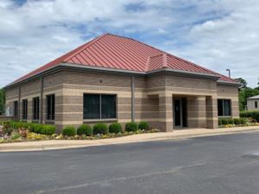 This free standing building is located  in dense medical and professional office area of West Russellville along Hwy 64 (W Main).  The property is directly across from Walgreens and just a block away from Millard Henry Clinic.  Situated on a 1.37 acre corner lot this property is perfect for financial institution, medical space, professional office or retail space.  Constructed in 2005 the interior of the building currently has lobby area, teller area, private offices, conference room  and break area.  Current site has 23 parking spaces and sees approx. 20,000+/- vehicles per day in last traffic count.  Property also has attached 880 sq foot drive through canopy.