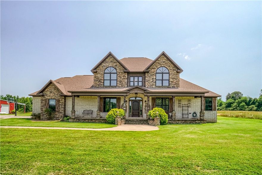 If you have been looking for a nice house with a shop, barn and 40 acres to no avail then today is your lucky day. The home is custom with tons of extras and at 3400 sq feet there's plenty of room to stretch out. You'll love the easy to take care of stained concrete, granite countertops, pot filler and double ovens with microwave convection. The living room ceiling is tall with a stacked rock fireplace that is spectacular. There are five or six bedrooms, one couple used ad a craft room. It has three full baths with tile showers that look like a million bucks. The front porch is perfect for rocking and relaxing and the covered patio out back makes a great area to entertain guests or hang out with the family. There is a 40x60 metal shop with a mother in law quarters and a horse barn with a concrete floor and 6 stalls. All this on 40 acres most of which is pasture. The rest is deer hunters dream. If this sounds like something that you'd feel at home in take a look