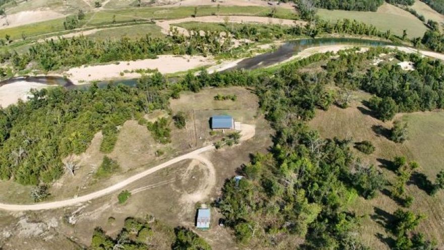 ?? 100+ Acre Recreational Farm with Home on Crooked Creek — Outdoor Paradise!  Welcome to your private retreat nestled on 100+ acres of stunning, multi-use land bordered on two sides by the pristine Crooked Creek. Whether you’re looking for a recreational haven, a working farm, or a peaceful place to call home, this property has it all. Enjoy floating, fishing, and hunting right outside your door in a true sportsman’s paradise. The land features two ponds, gently rolling pasture, and wooded areas teeming with wildlife. A barn, cow waterer, hayfield and two additional wells make this property ideal for cattle, horses, or hobby farming or could open up opportunities to build a new home or hook up an RV/mobile home. The cozy 2BR/2BA home offers comfort and charm with a large deck overlooking the creek—the perfect place to sip your morning coffee while taking in the sounds of nature. The unfinished basement provides room to expand or customize to your needs. Call for showing today!